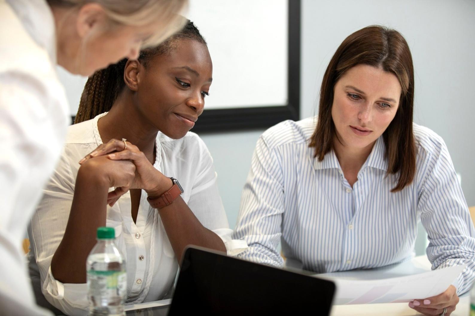 Person reviewing financial documents and planning budget